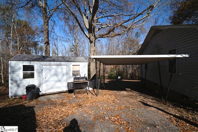 view of outbuilding with a carport