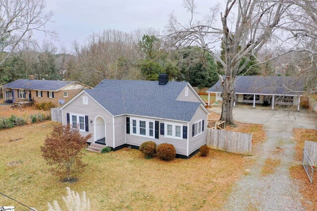 exterior space with a front yard and a carport