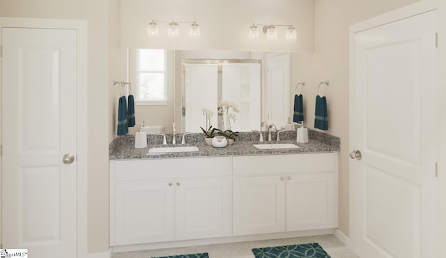 bathroom with tile patterned floors, vanity, and an enclosed shower