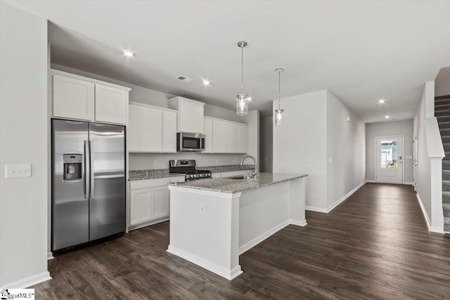 kitchen with white cabinetry, sink, an island with sink, and stainless steel appliances