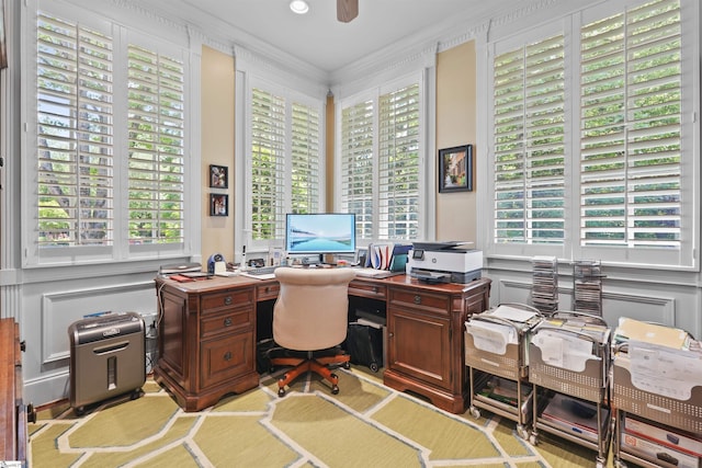 office featuring ceiling fan and crown molding