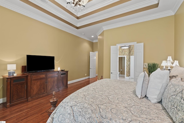 bedroom with a chandelier, dark hardwood / wood-style floors, and crown molding