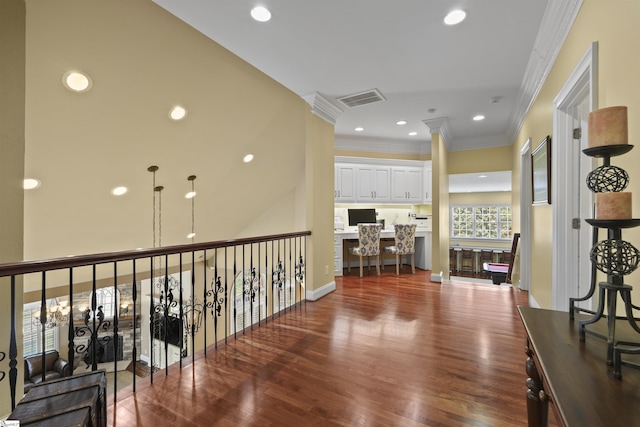 corridor with crown molding and dark hardwood / wood-style floors