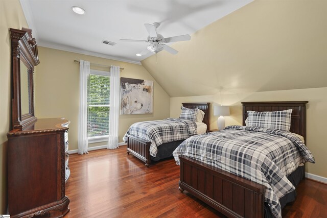 bedroom featuring ceiling fan, dark hardwood / wood-style floors, and vaulted ceiling