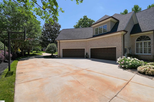 view of side of property featuring a garage