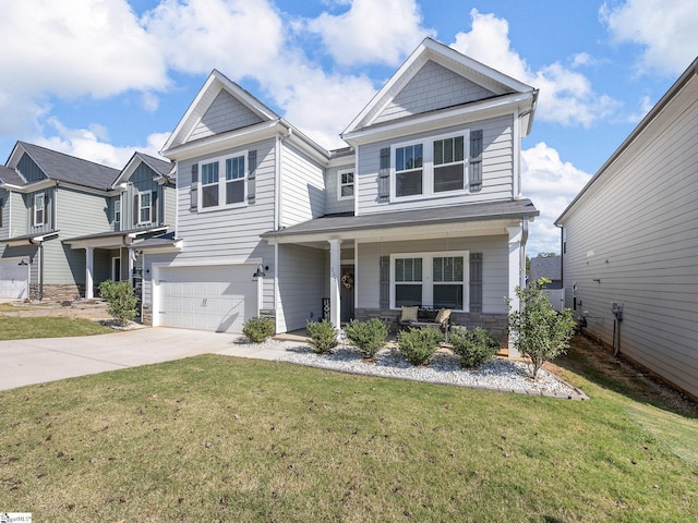 craftsman house with covered porch, a front yard, and a garage