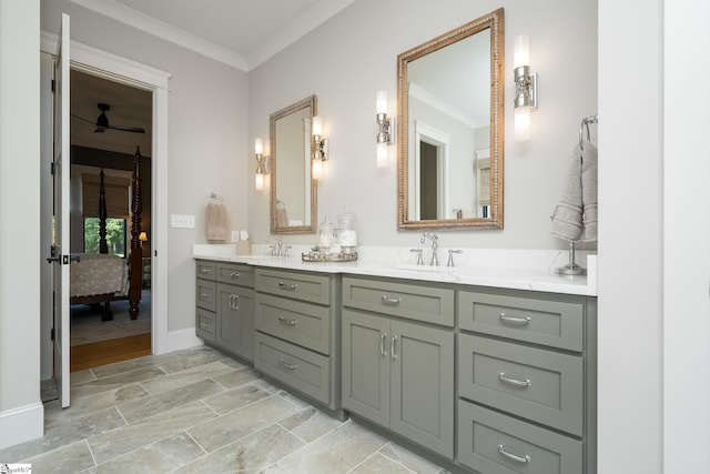 bathroom with ceiling fan, vanity, and ornamental molding