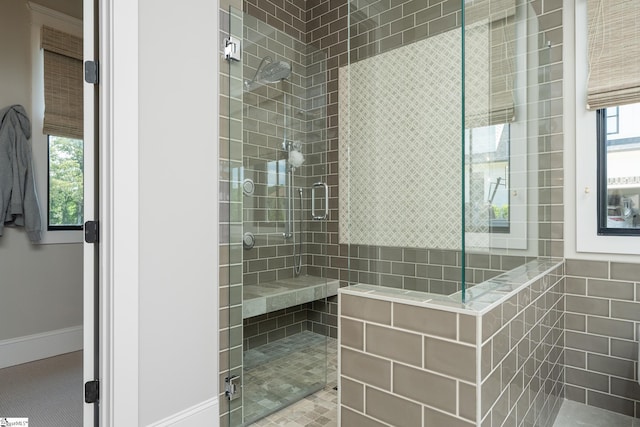 bathroom with a tile shower