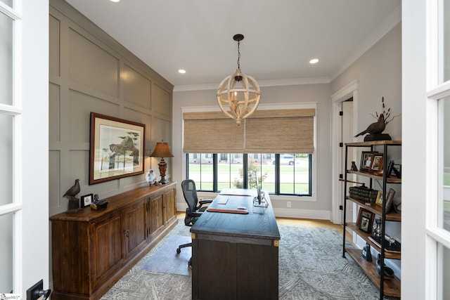 office area featuring crown molding, light hardwood / wood-style flooring, and a chandelier