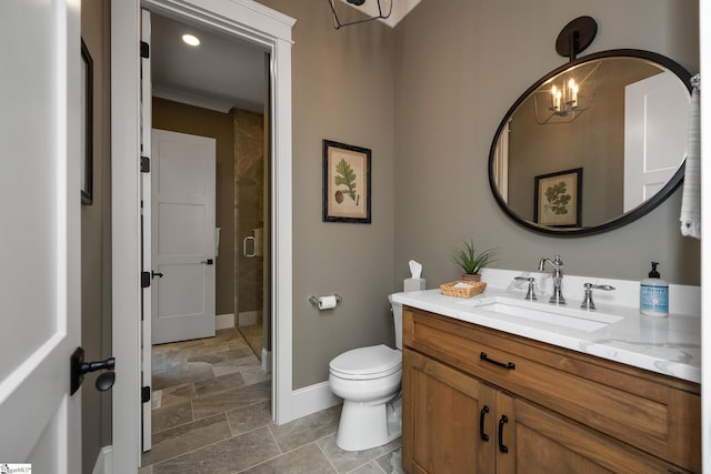 bathroom with vanity, toilet, walk in shower, and a notable chandelier