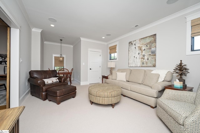 carpeted living room featuring crown molding