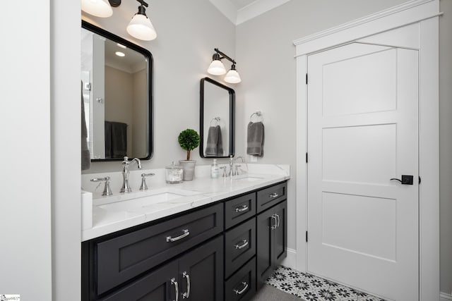 bathroom with tile patterned flooring, vanity, and crown molding