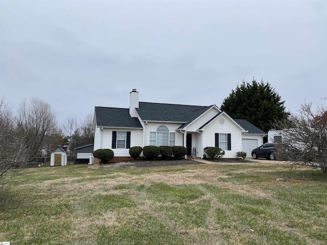 ranch-style home with a front yard and a garage