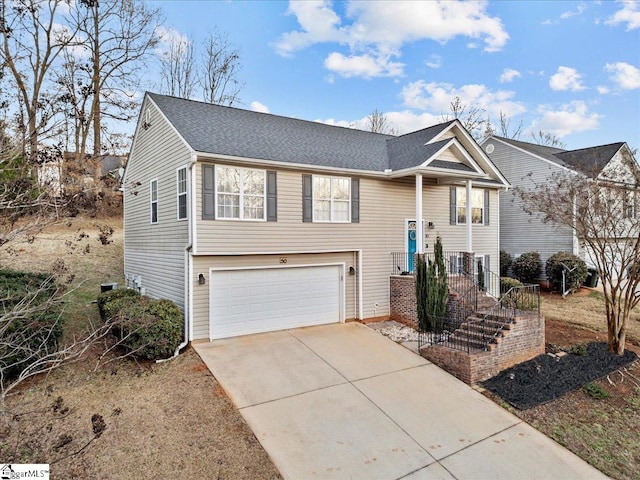 raised ranch featuring a garage