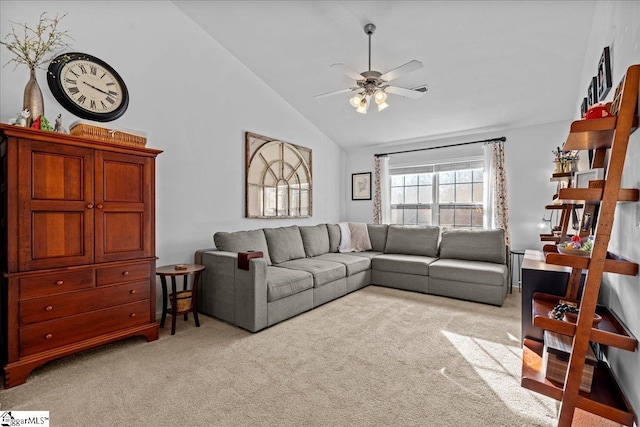 carpeted living room featuring ceiling fan and vaulted ceiling