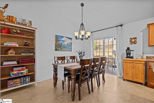 dining area with an inviting chandelier