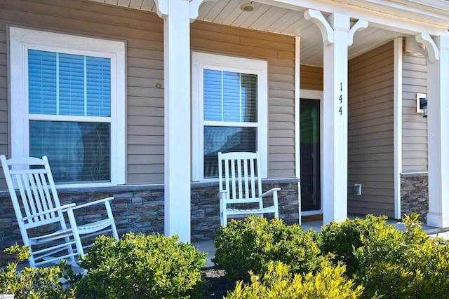 entrance to property featuring a porch