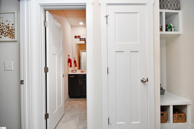 corridor with light tile patterned floors