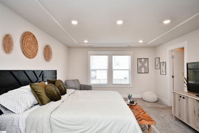 bedroom with light colored carpet