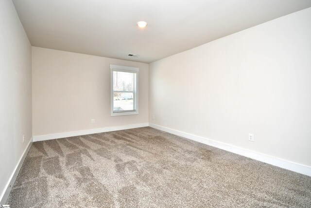 spare room featuring carpet flooring