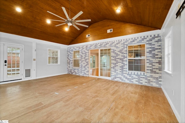 unfurnished living room with vaulted ceiling, ceiling fan, light wood-type flooring, wood ceiling, and brick wall