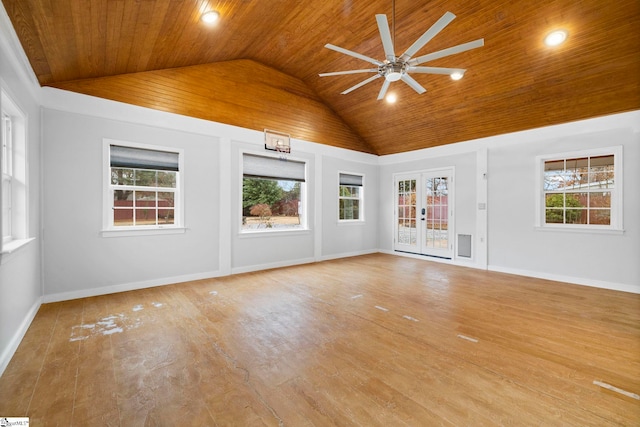 unfurnished living room featuring a healthy amount of sunlight, wood ceiling, and ceiling fan with notable chandelier