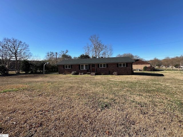 ranch-style house with a front yard