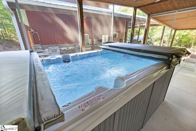 view of swimming pool with exterior kitchen