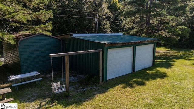 garage featuring a lawn