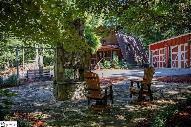 view of patio / terrace featuring an outbuilding