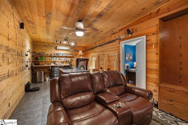 cinema room with wood walls, an AC wall unit, rail lighting, ceiling fan, and wood ceiling