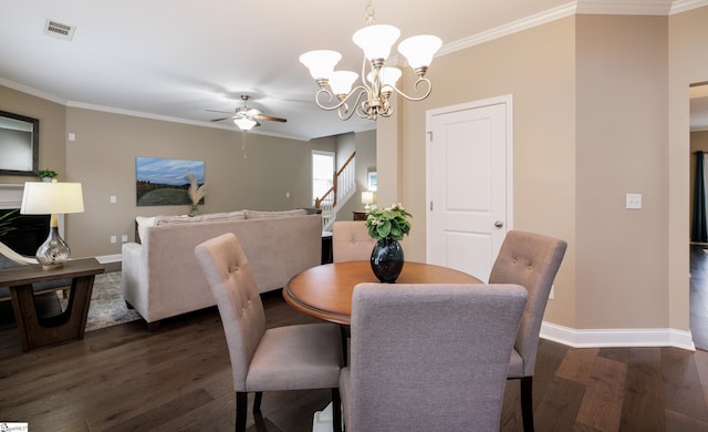 dining area with crown molding, dark hardwood / wood-style floors, and ceiling fan with notable chandelier