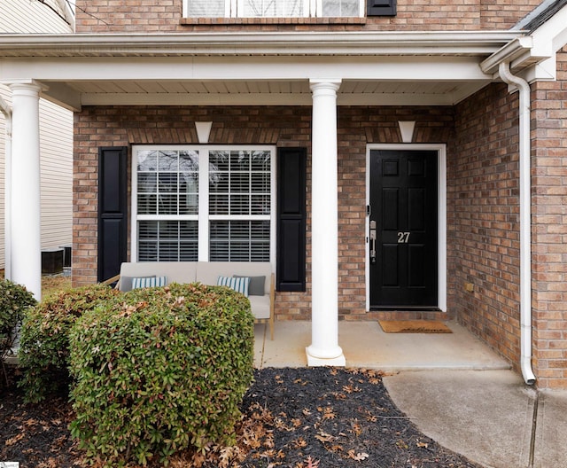 entrance to property featuring a porch