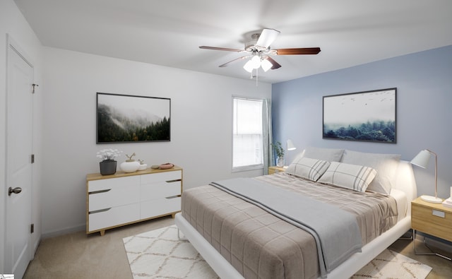 bedroom featuring ceiling fan and light colored carpet