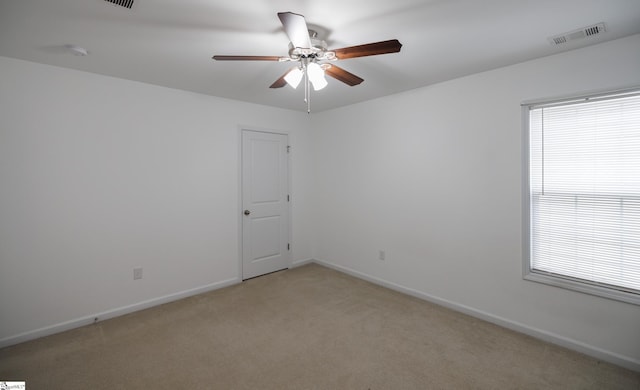 carpeted spare room with plenty of natural light