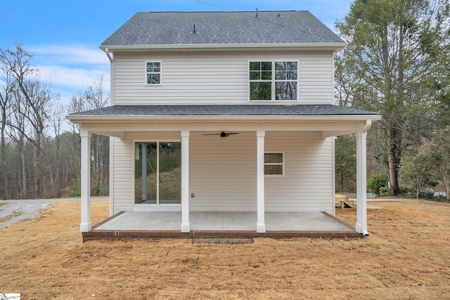 rear view of house featuring ceiling fan and a patio