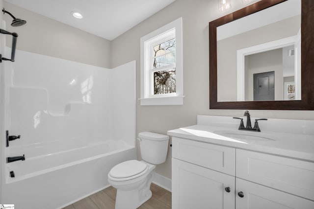 full bathroom with vanity, toilet, and shower / washtub combination