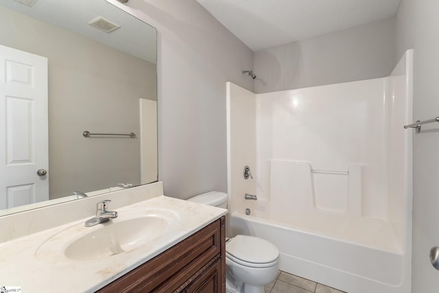 full bathroom featuring tile patterned flooring, shower / tub combination, vanity, and toilet