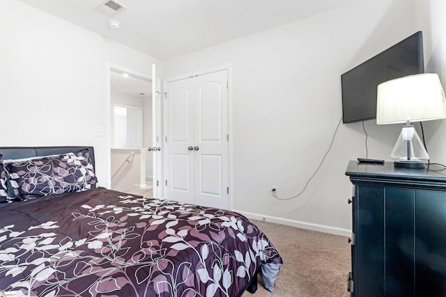 carpeted bedroom featuring a closet