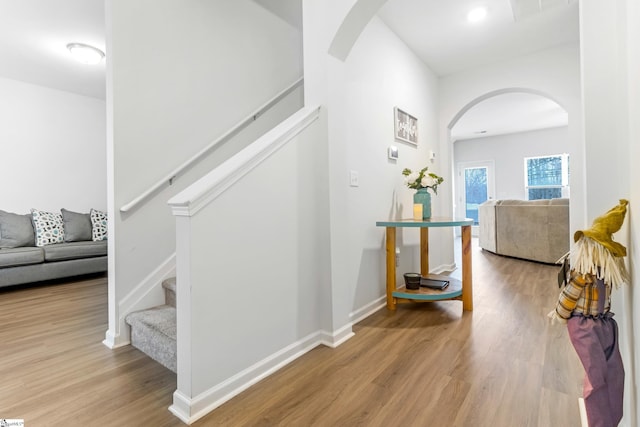 stairs with wood-type flooring