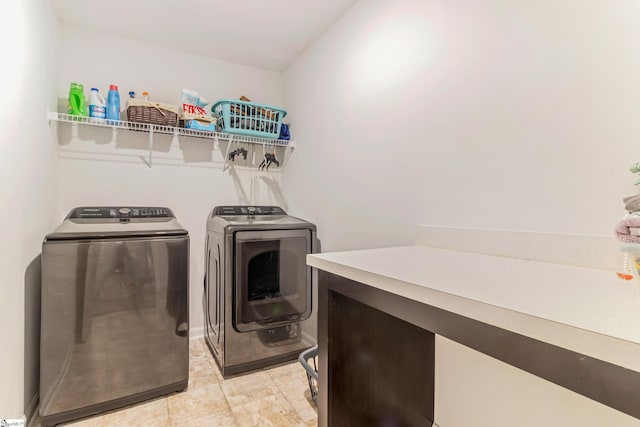 clothes washing area with washing machine and clothes dryer