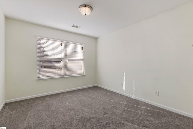 empty room featuring carpet flooring