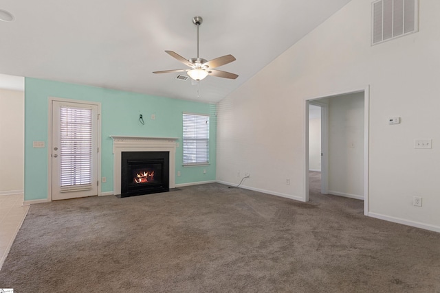 unfurnished living room featuring carpet flooring, ceiling fan, and high vaulted ceiling