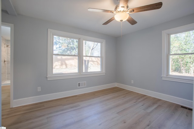 unfurnished room featuring ceiling fan and light wood-type flooring