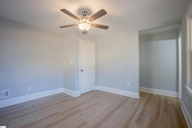 unfurnished bedroom with ceiling fan and light hardwood / wood-style flooring