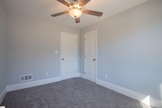 carpeted empty room with ceiling fan