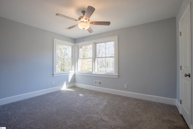 carpeted empty room with ceiling fan