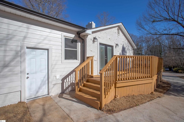 view of exterior entry featuring french doors