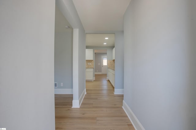 corridor featuring light hardwood / wood-style flooring