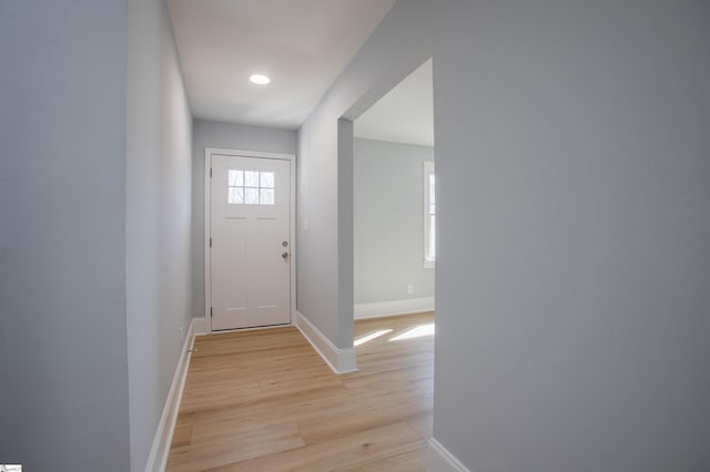 doorway with light wood-type flooring